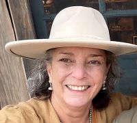 Middle age smiling woman in a hat